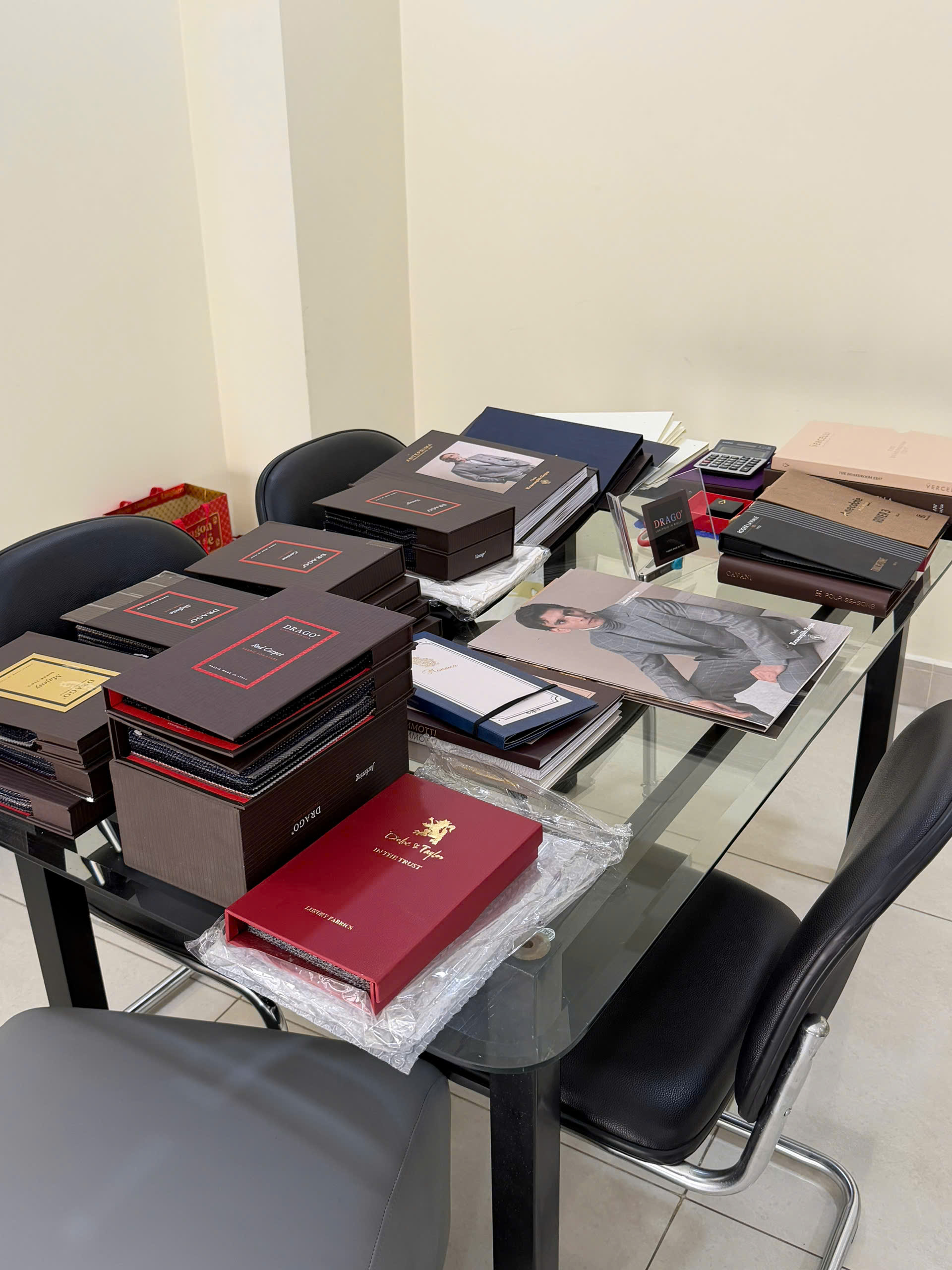 Reviewing fabric catalogues at a Vietnamese textile factory